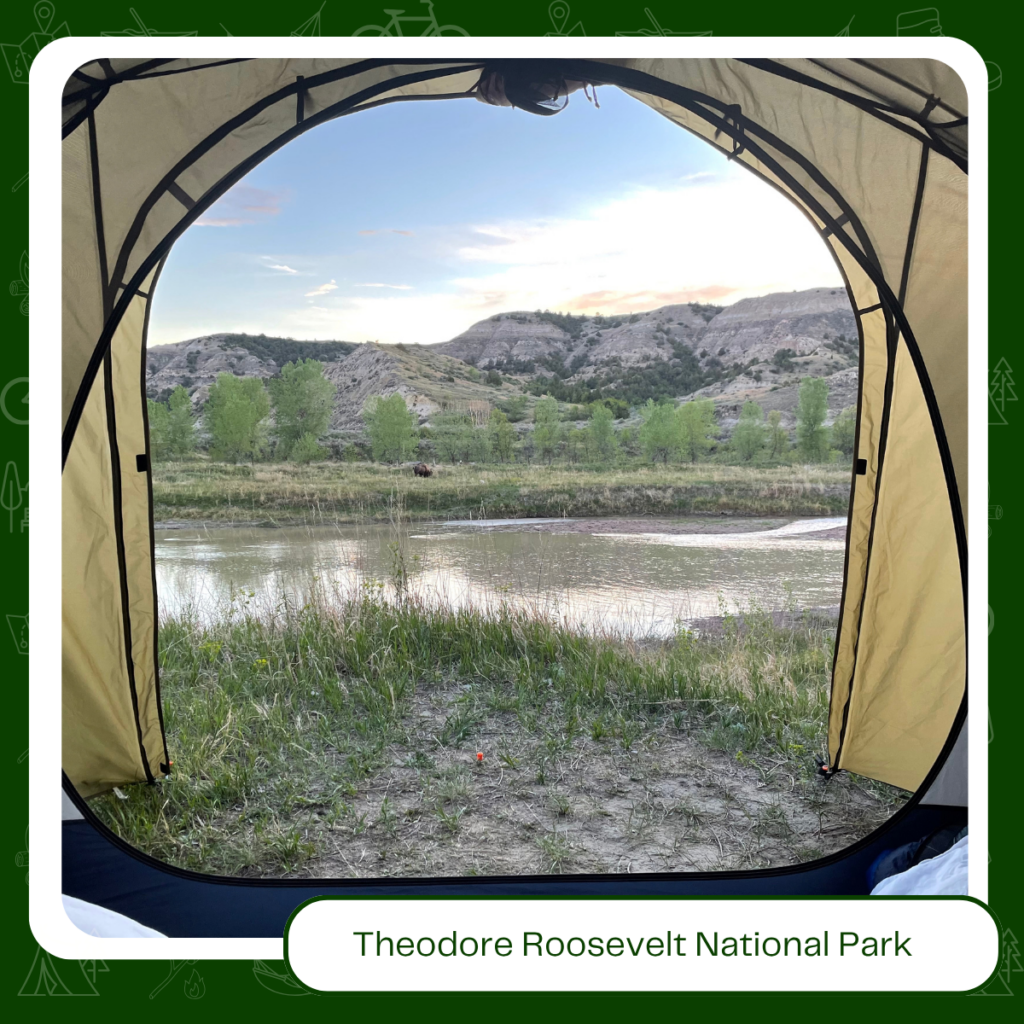 Theodore Roosevelt National Park, North Dakota — a tent lit up under a cottonwood tree at dusk