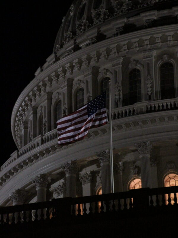 The Capitol dome with the United States flag flying